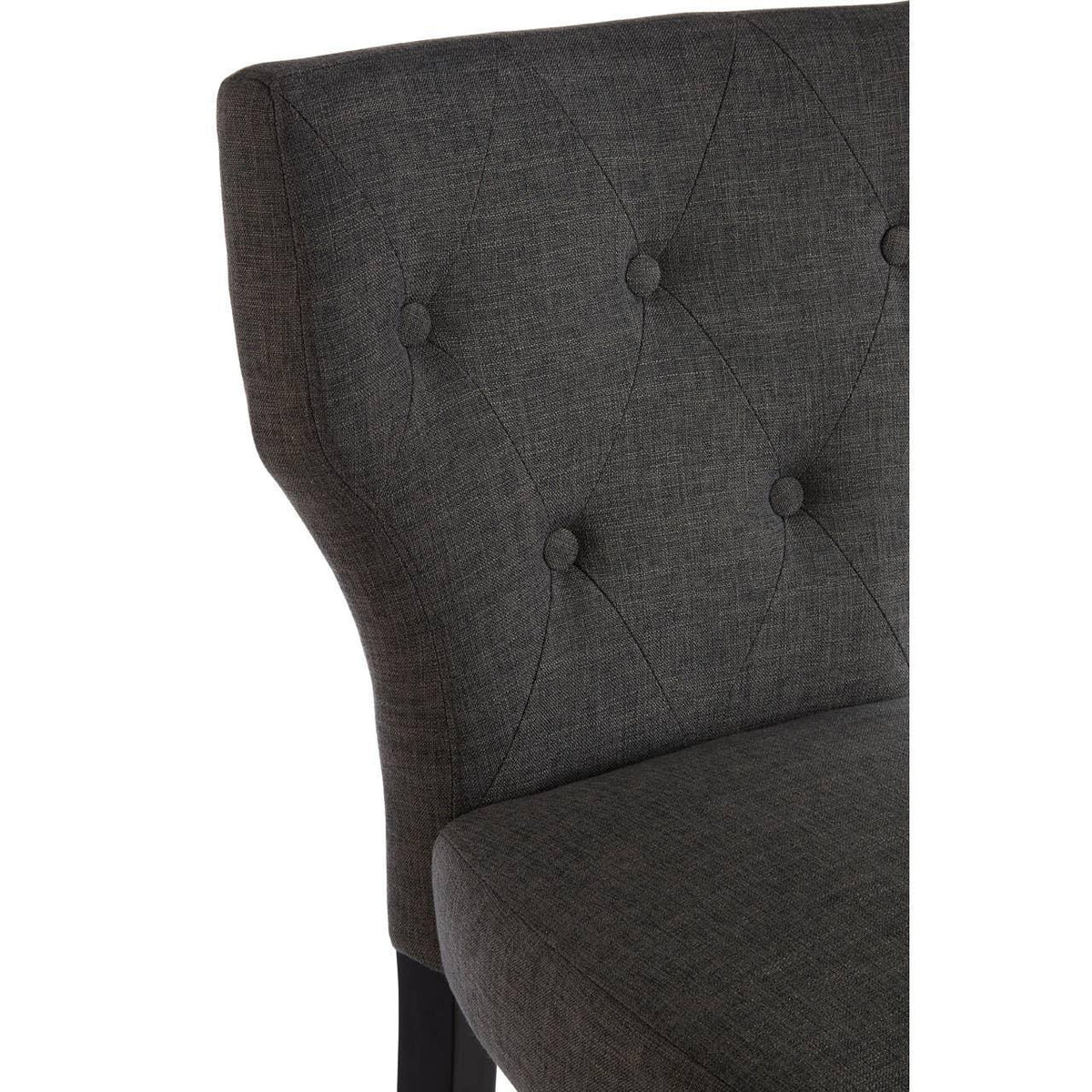 Dark grey upholstered dining chair with button-tufted backrest and textured fabric