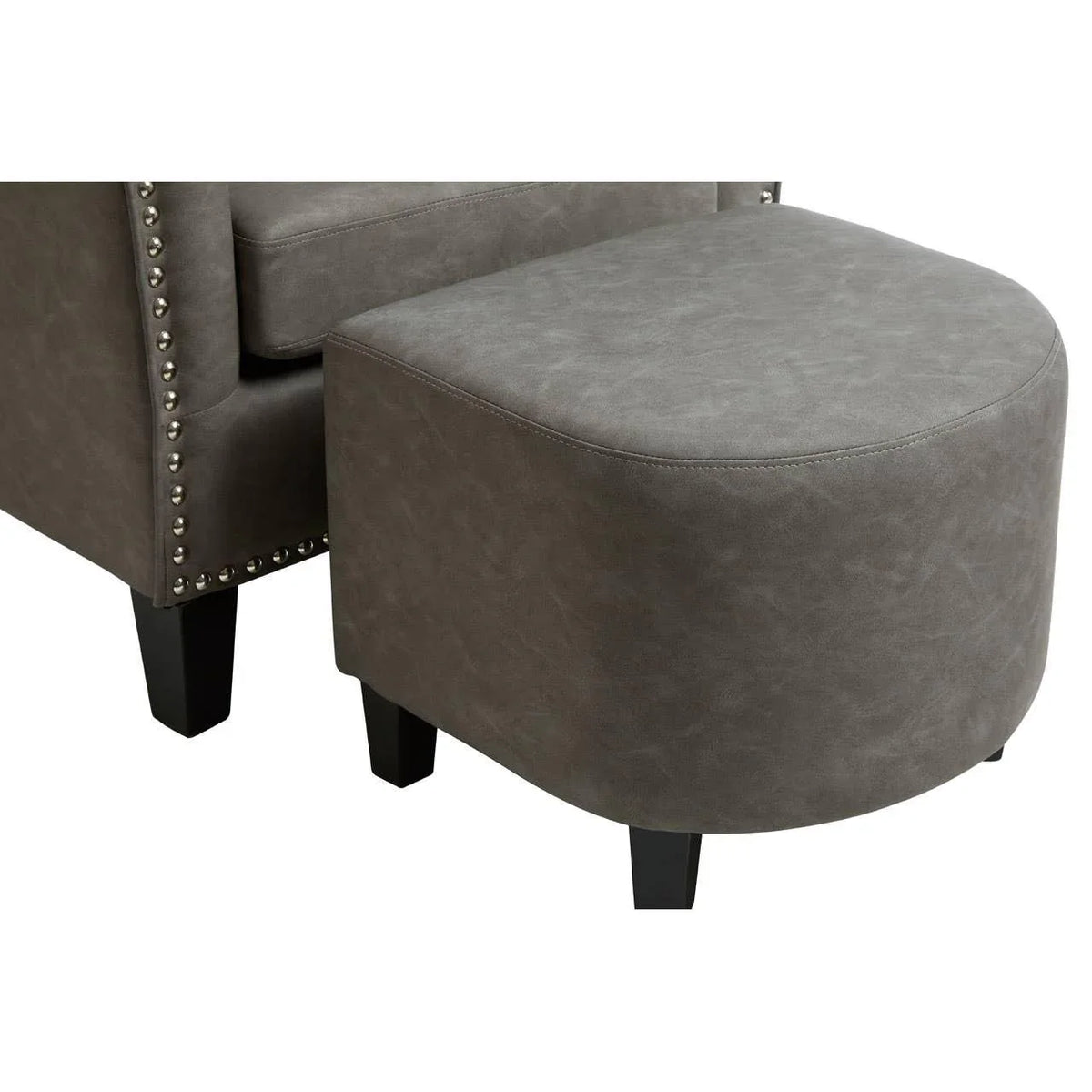 Grey faux leather ottoman with studded armchair detail and black wooden legs