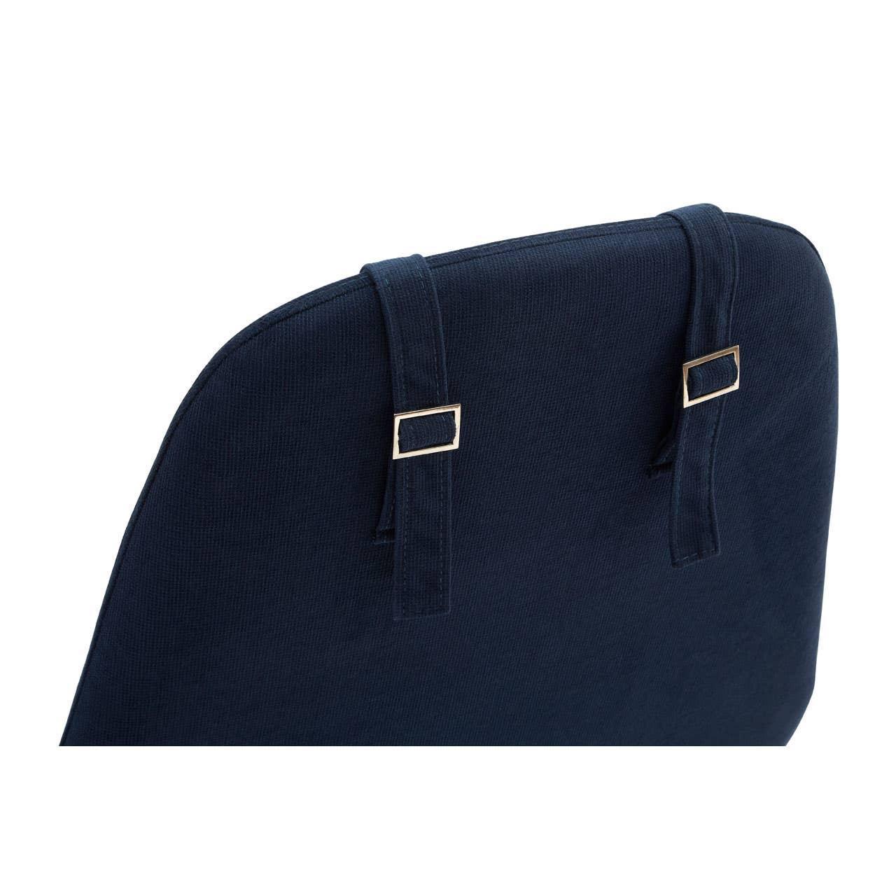 Navy blue chair cushion with adjustable fabric straps and metal buckles detail
