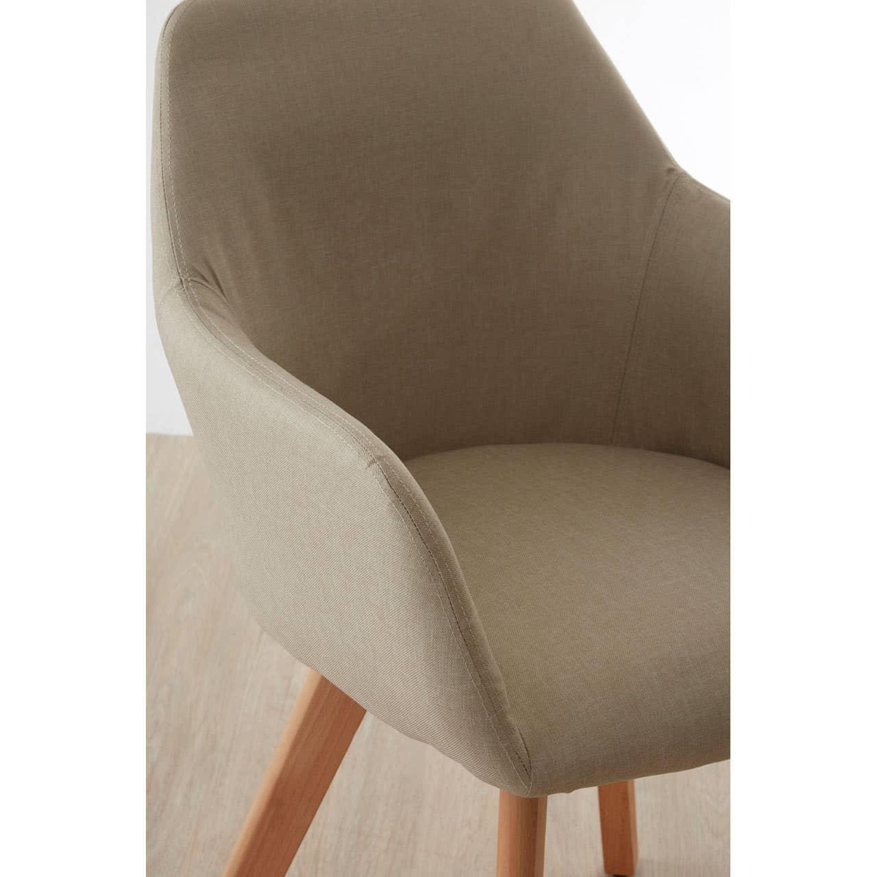 Taupe fabric dining chair with curved back and light wooden legs on oak floor