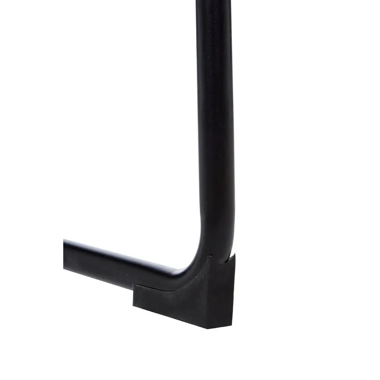 Close-up of black metal furniture leg with rubber foot protector