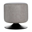 A round pouffe upholstered in ash grey faux leather, featuring a smooth, rounded top and a sleek black base. The design is modern and minimalist, suitable for various home decor styles