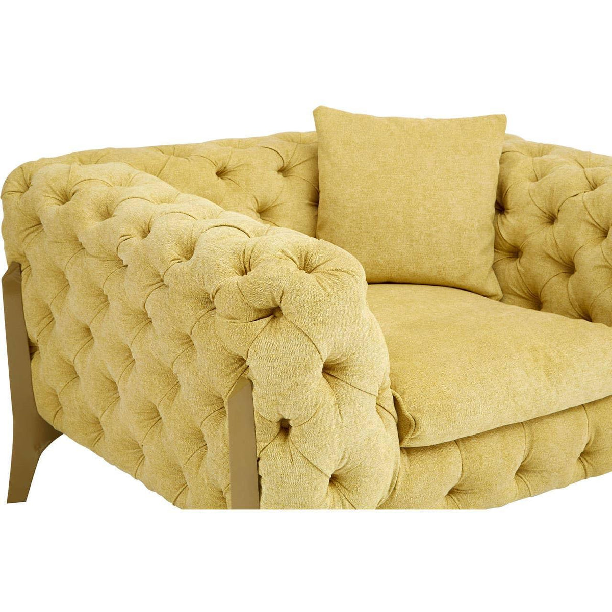 Yellow tufted fabric armchair with matching cushion and deep seat, front angled view