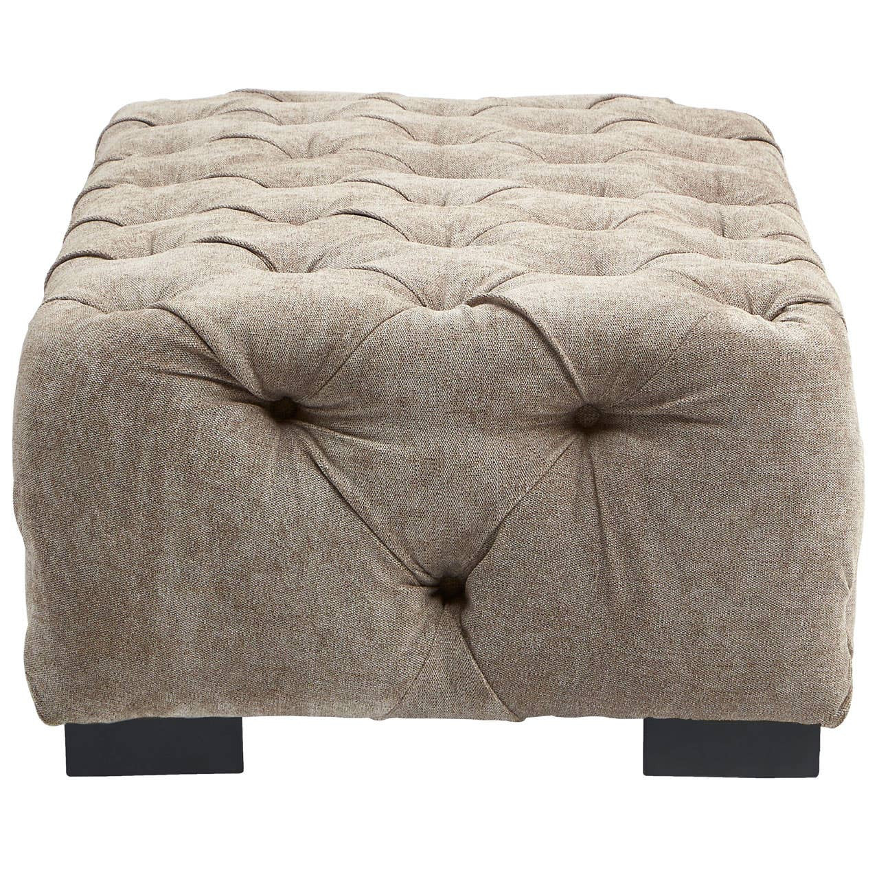 Rectangular footstool upholstered in natural fabric with a tufted design, featuring a soft, textured surface and four dark wooden legs. The footstool has a neutral beige color that complements various decor styles