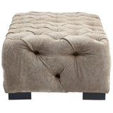 Rectangular footstool upholstered in natural fabric with a tufted design, featuring a soft, textured surface and four dark wooden legs. The footstool has a neutral beige color that complements various decor styles