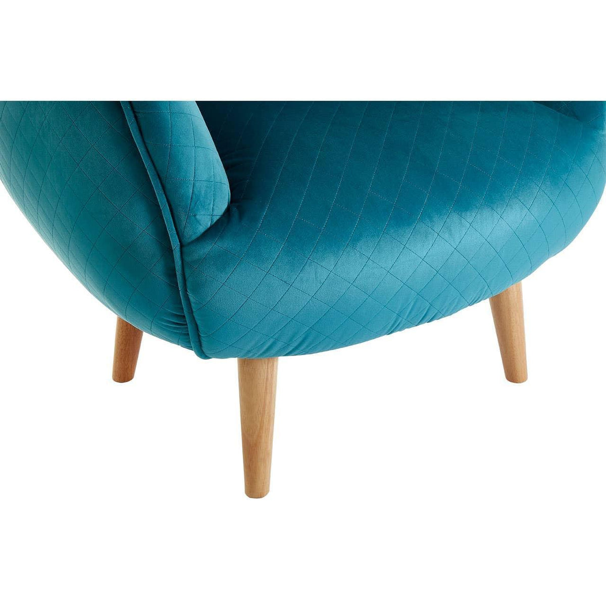 Blue accent chair with quilted upholstery and wooden legs, close-up corner view