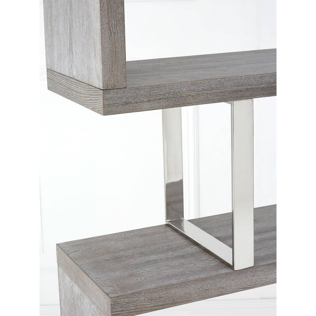 Grey wood shelving unit with chrome metal support detail, close-up view