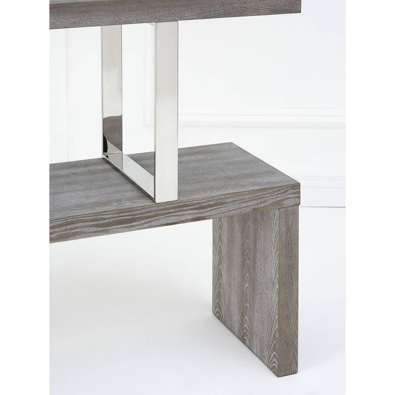 Grey wood console table with chrome metal support, close-up of leg and lower shelf detail