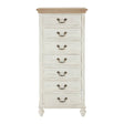 Antique style chest featuring a light-colored wooden top and a distressed white finish, with seven drawers adorned with metal handles, standing on elegantly curved legs
