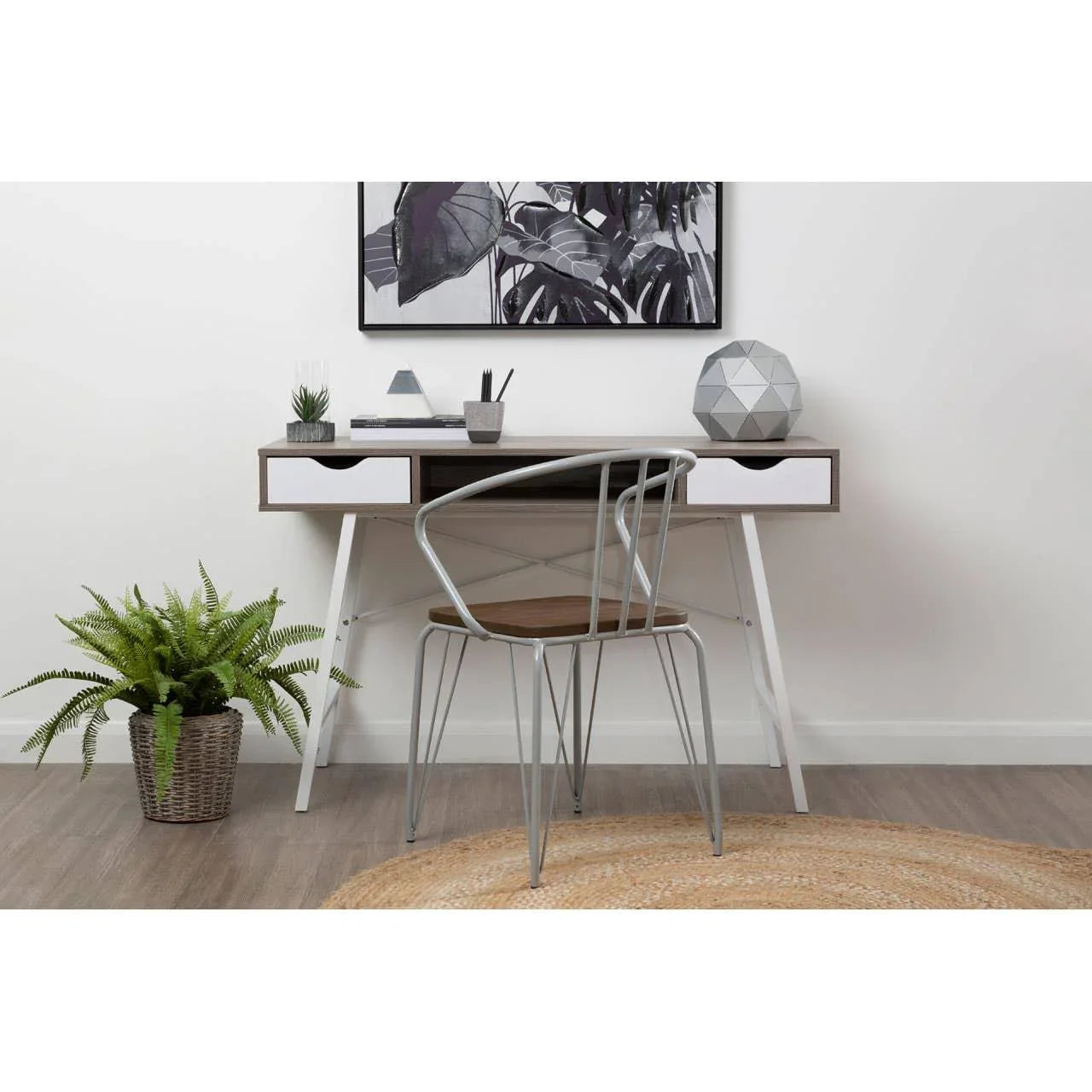 Modern wooden study desk with white drawers and metal chair in minimalist home office