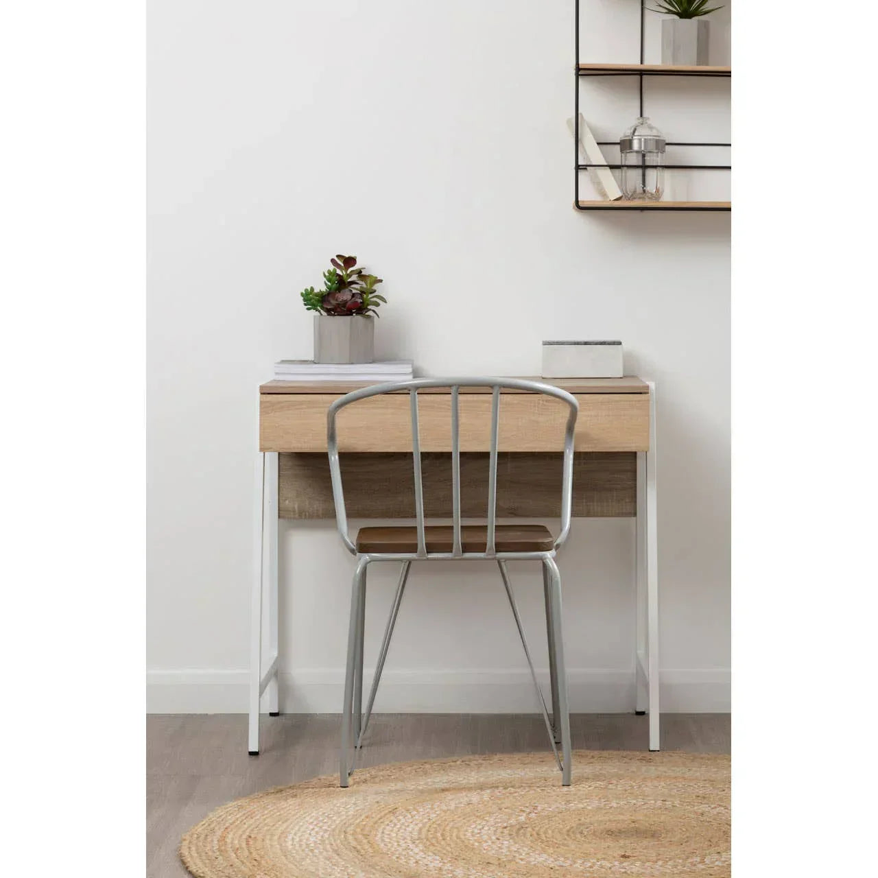 Oak effect desk with metal legs and a grey metal chair in a modern home office setting