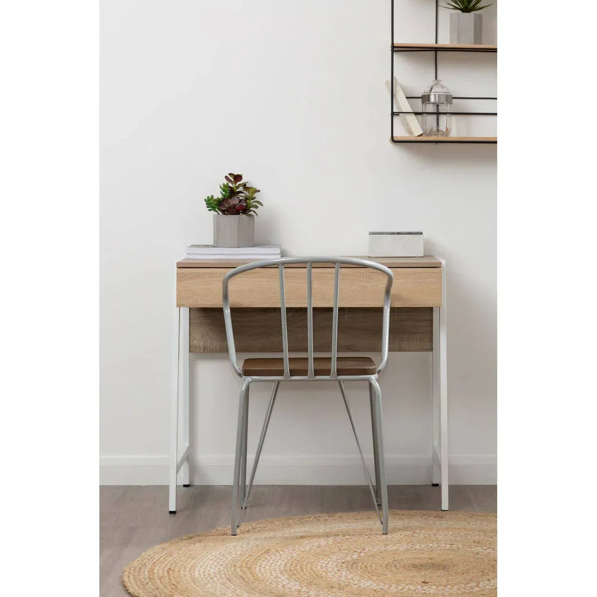 Oak effect desk with metal legs and a grey metal chair in a modern home office setting
