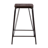 A tall stool featuring a black metal frame and a rectangular elm wood seat, designed with clean lines and a minimalist aesthetic. The stool has four slender legs and a footrest for added comfort