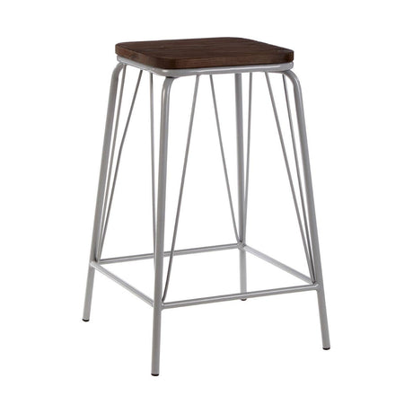 A tall stool featuring a square elm wood seat with a rich brown finish, supported by a sleek grey metal frame with four slender legs and a footrest for added comfort