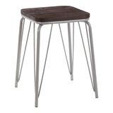 Small stool featuring a square dark wood seat made of elm, supported by slender grey metal legs that create a modern and minimalist design. The stool has a clean and simple aesthetic, suitable for various home decor styles
