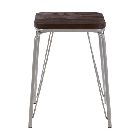 Small stool featuring a dark brown wood seat made of elm, supported by sleek grey metal legs with a modern design. The legs are angled and provide a sturdy base, while the overall look is minimalist and contemporary