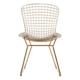 Gold metal wire chair with a grid frame design and slender legs, featuring a rounded backrest and a minimalist aesthetic suitable for modern home decor