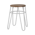 A grey metal hairpin stool with a round wooden seat, featuring slender, angled legs that create a modern and minimalist design. The stool has a light wood finish on the seat and a contrasting white metal frame