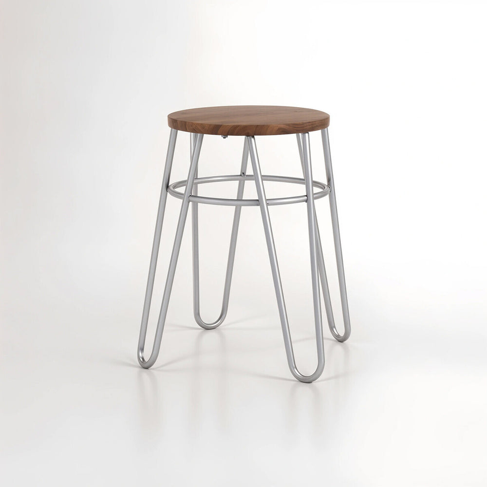 A grey metal hairpin stool with a round wooden seat and four slender, angled legs, set against a plain white background