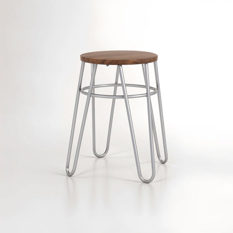 A grey metal hairpin stool with a round wooden seat and four slender, angled legs, set against a plain white background