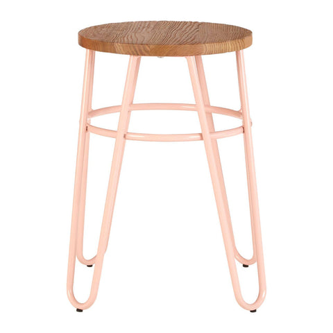 A hairpin stool featuring a round elm wood seat with a natural finish, supported by slender pink metal legs that create a modern and stylish look