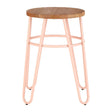 A hairpin stool featuring a round elm wood seat with a natural finish, supported by slender pink metal legs that create a modern and stylish look