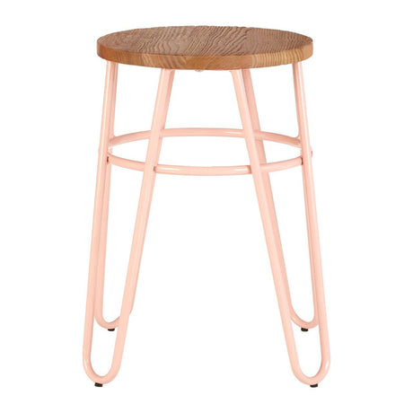 A hairpin stool featuring a round elm wood seat with a natural finish, supported by slender pink metal legs that create a modern and stylish look