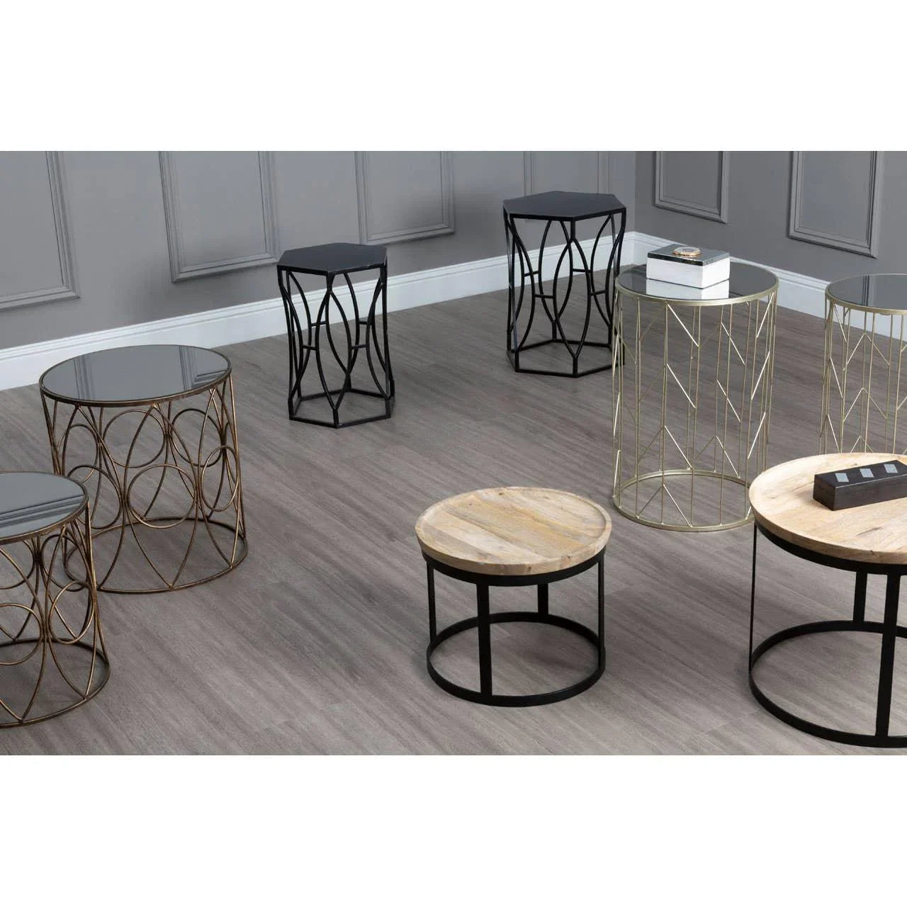 Modern round and hexagonal side tables with metal frames and mixed wood or glass tops