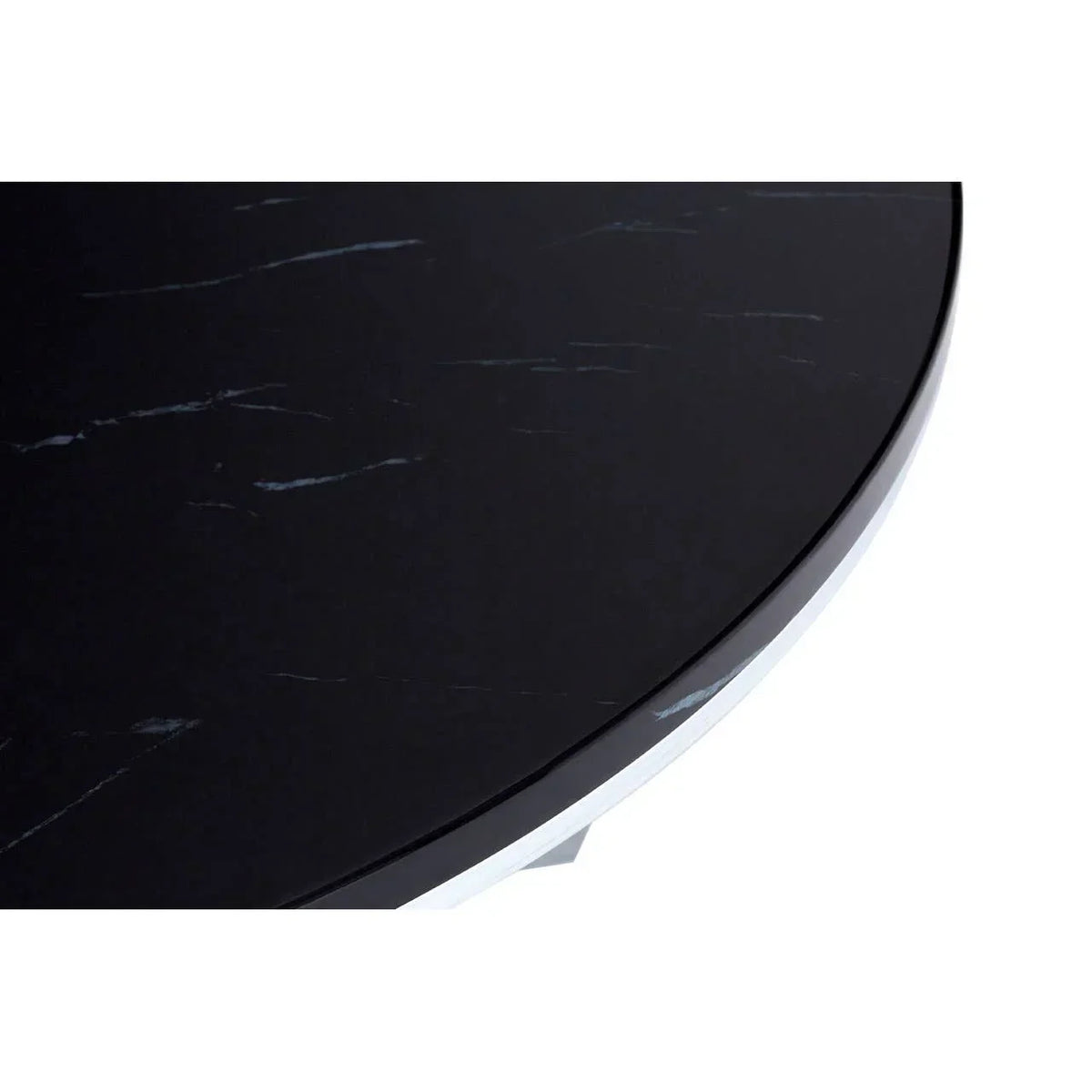 Close up of round black marble table top with subtle white veining detail
