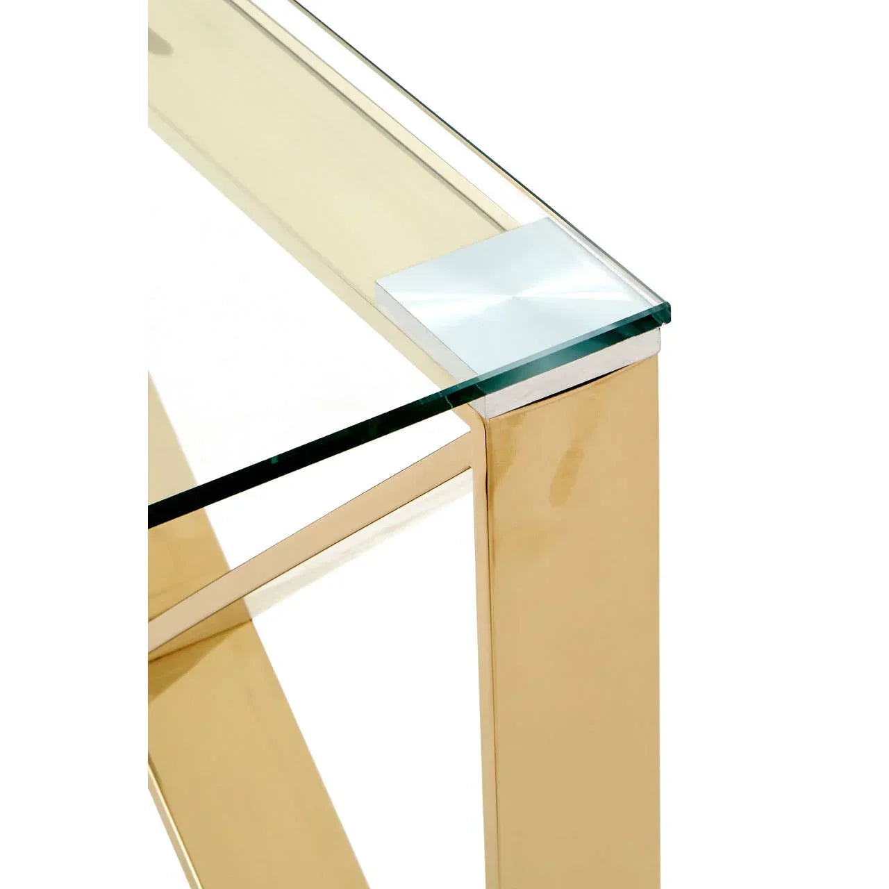 Gold metal console table with clear glass top, close view of angled corner and frame detail