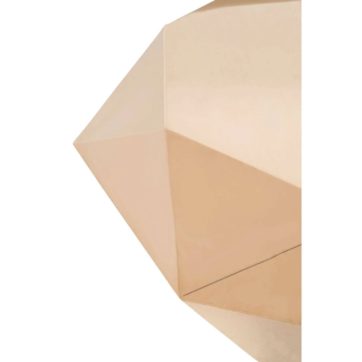 Geometric gold metal accent table close up showing faceted surface texture