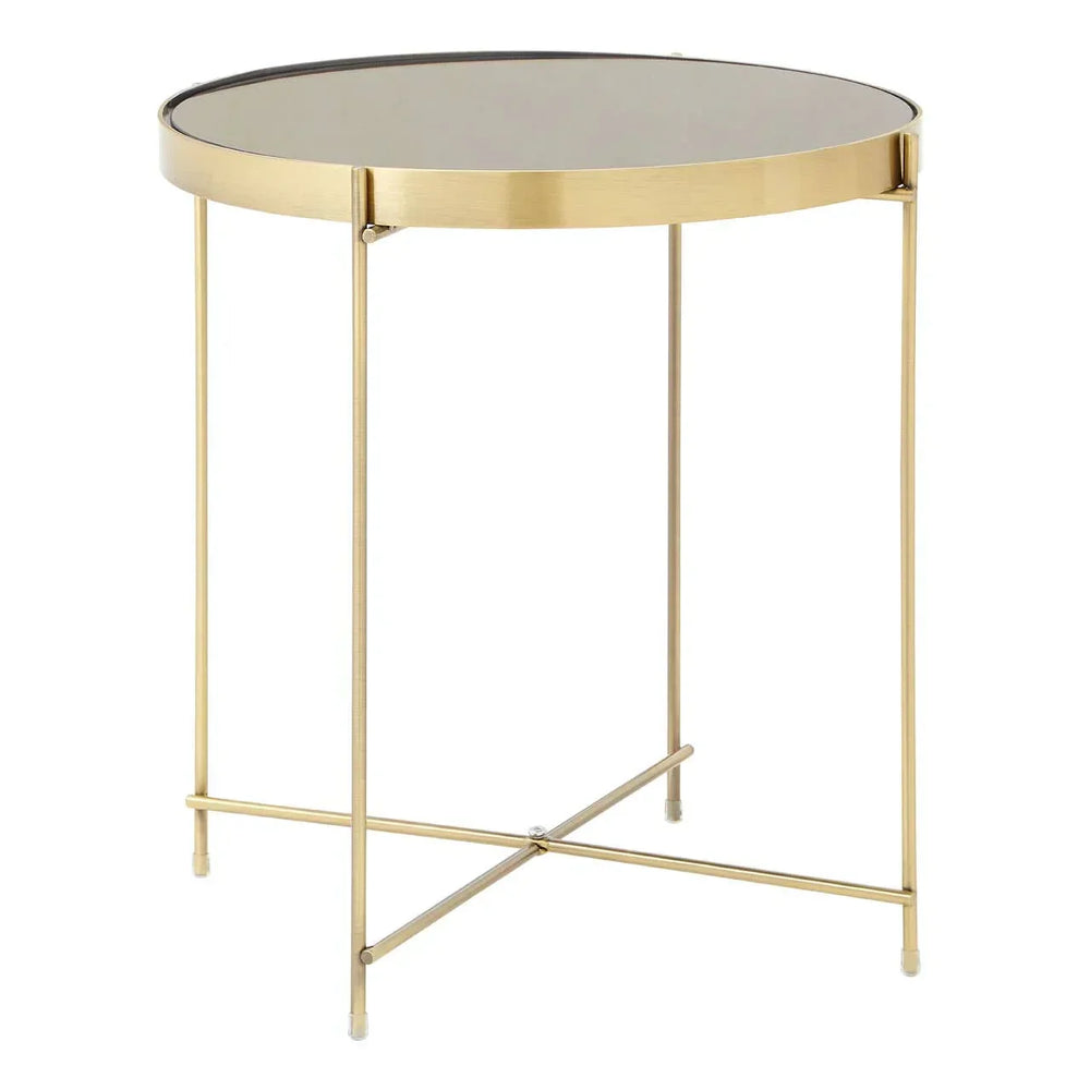 Gold metal side table with round glass top and slim crossed legs