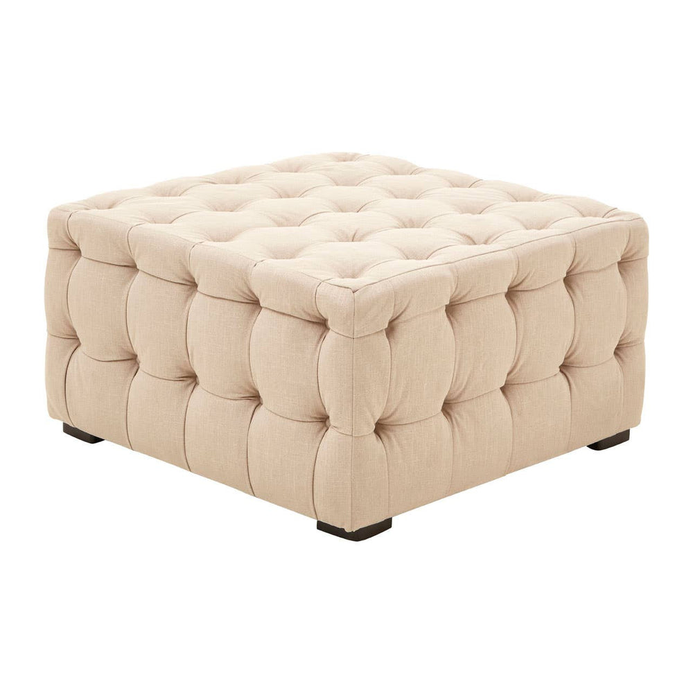 Beige linen stool with a square shape, featuring button tufting and a soft, padded surface. The stool has a classic design with visible stitching and small wooden legs