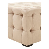 Beige linen stool featuring a button-tufted design with a square top and rounded edges, resting on a small black base