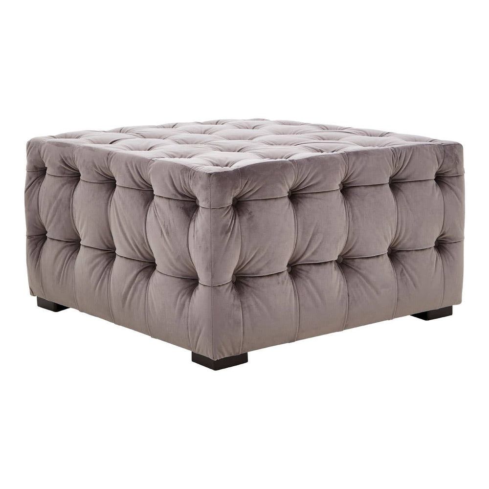 Square stool upholstered in soft grey velvet with button tufting, featuring a plush top and sturdy black legs