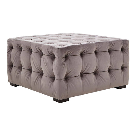 Square stool upholstered in soft grey velvet with button tufting, featuring a plush top and sturdy black legs