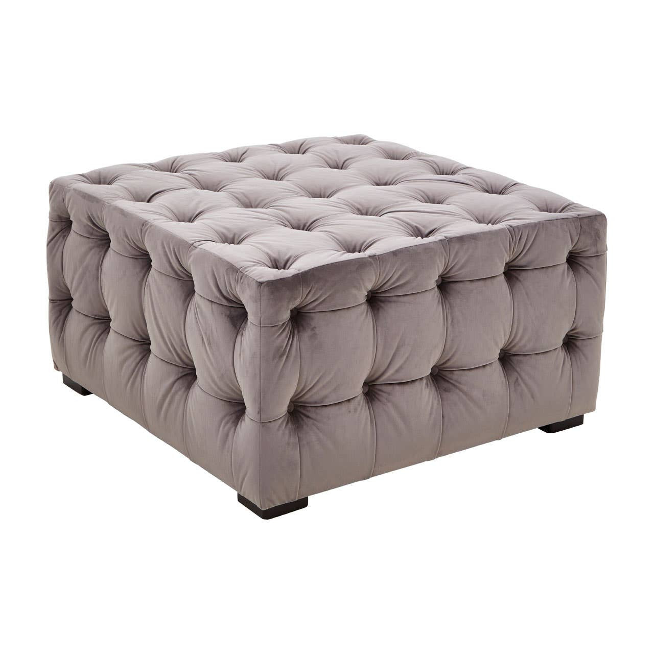 Square stool upholstered in soft grey velvet, featuring a button-tufted design with deep indentations and a smooth surface. The stool has rounded corners and rests on four small, dark legs