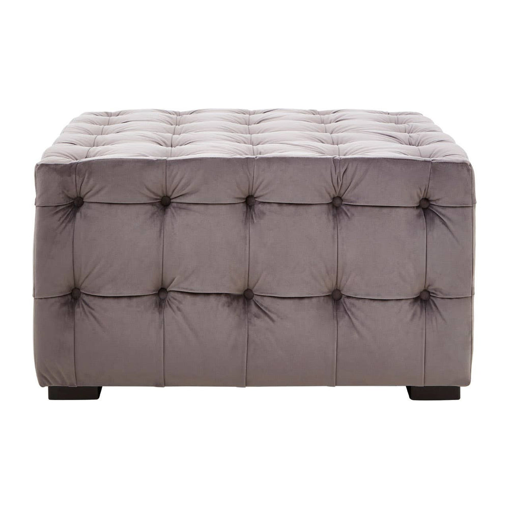 Grey velvet stool featuring a button-tufted design with a rectangular shape and dark wooden legs. The surface is plush and smooth, showcasing a sophisticated and modern aesthetic