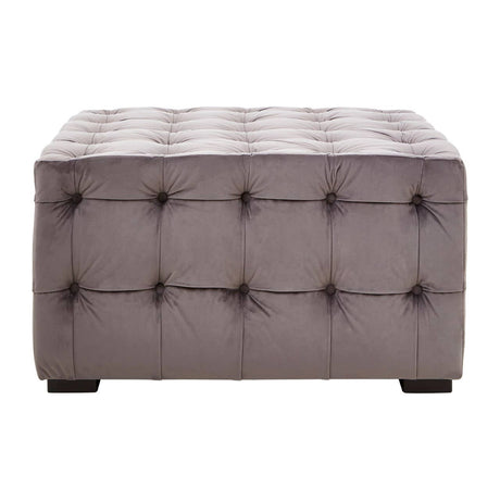 Grey velvet stool featuring a button-tufted design with a rectangular shape and dark wooden legs. The surface is plush and smooth, showcasing a sophisticated and modern aesthetic