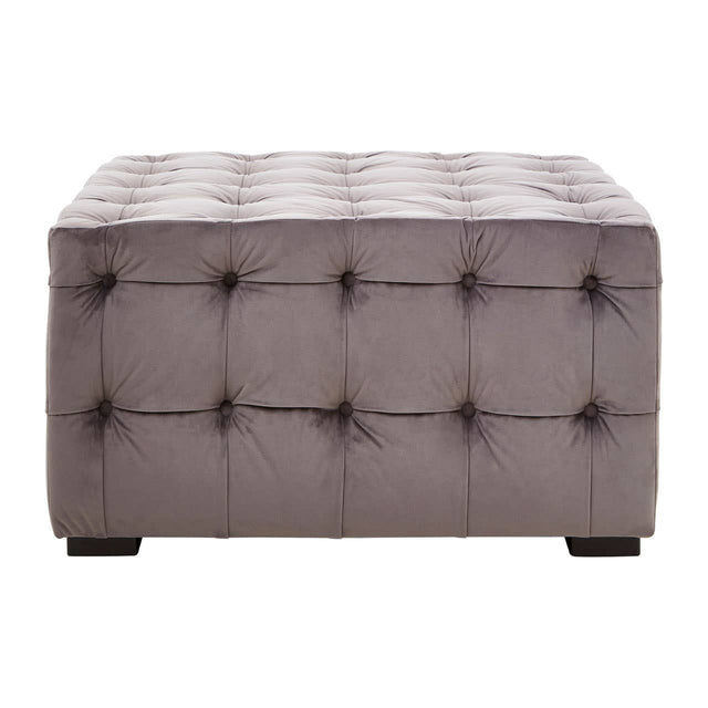 Grey velvet stool featuring a button-tufted design with a rectangular shape and dark wooden legs. The surface is plush and smooth, showcasing a sophisticated and modern aesthetic