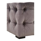 Grey velvet stool with a button-tufted design, featuring a square shape and a sturdy base. The fabric has a soft texture, and the tufting creates a plush, elegant appearance