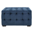 Midnight blue velvet button stool featuring a tufted design with multiple buttons, resting on dark wooden legs. The rectangular shape and plush upholstery add a touch of elegance to home decor