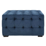 Midnight blue velvet button stool featuring a tufted design with multiple buttons, resting on dark wooden legs. The rectangular shape and plush upholstery add a touch of elegance to home decor