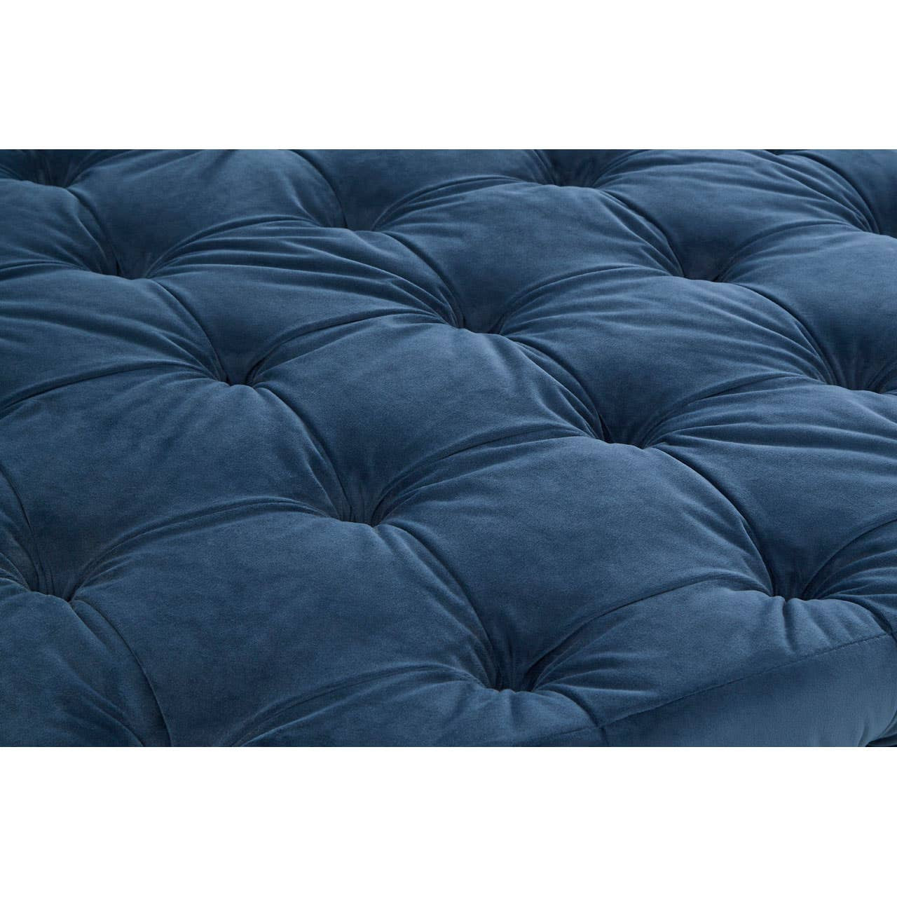 Midnight blue velvet fabric with a tufted design featuring prominent buttons, creating a plush and luxurious texture. The stool has a rounded shape and a soft, inviting surface