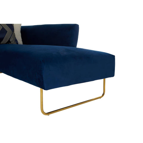 Dark blue velvet corner sofa with a sleek design, featuring a gold metal base and a plush seat. A decorative throw pillow is positioned on the backrest, enhancing the modern aesthetic. The sofa's clean lines and rich color create an elegant focal point for any living space