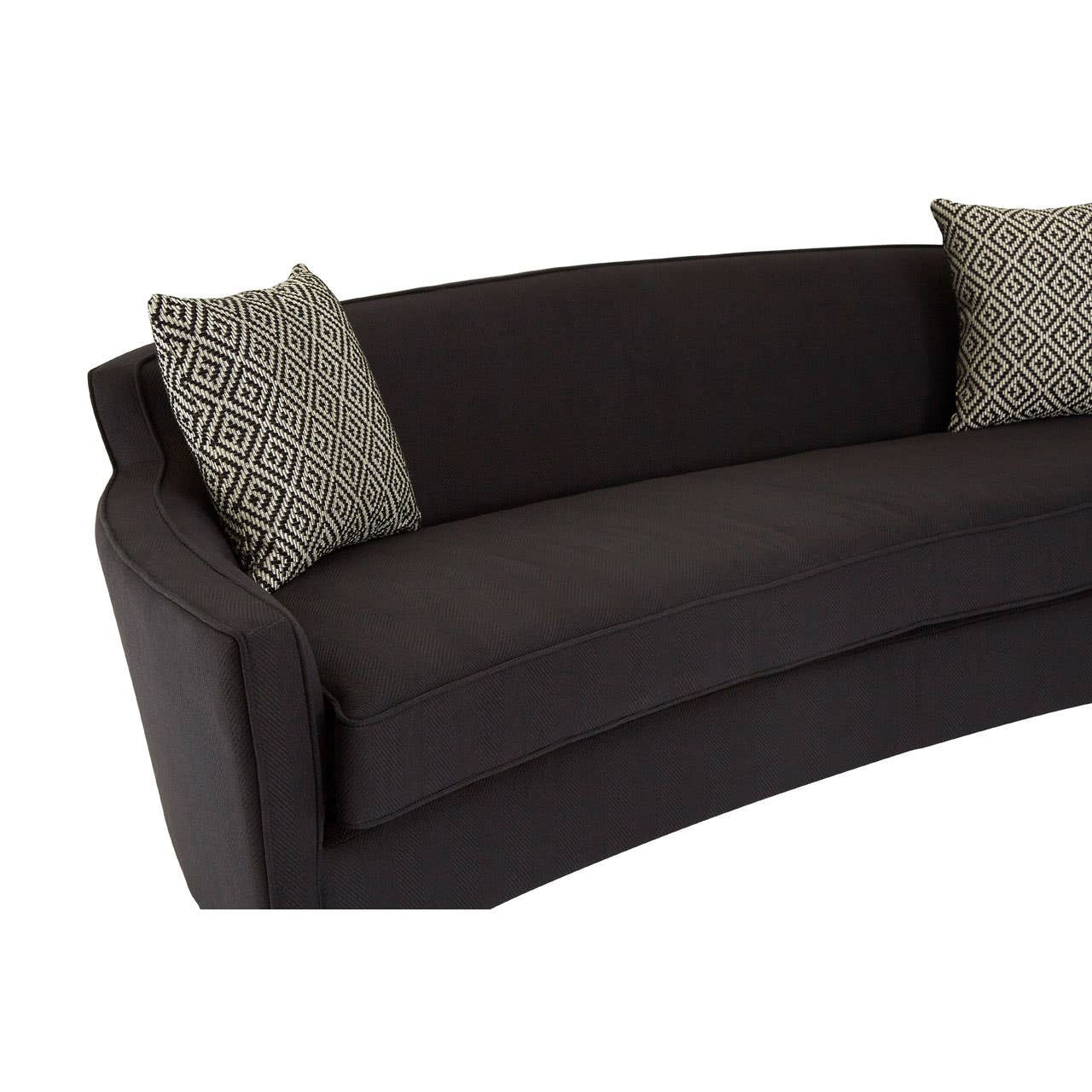 Three-seat sofa upholstered in black dimity fabric, featuring a curved design and two decorative throw pillows with a geometric pattern. The sofa has a sleek, modern silhouette and a low profile