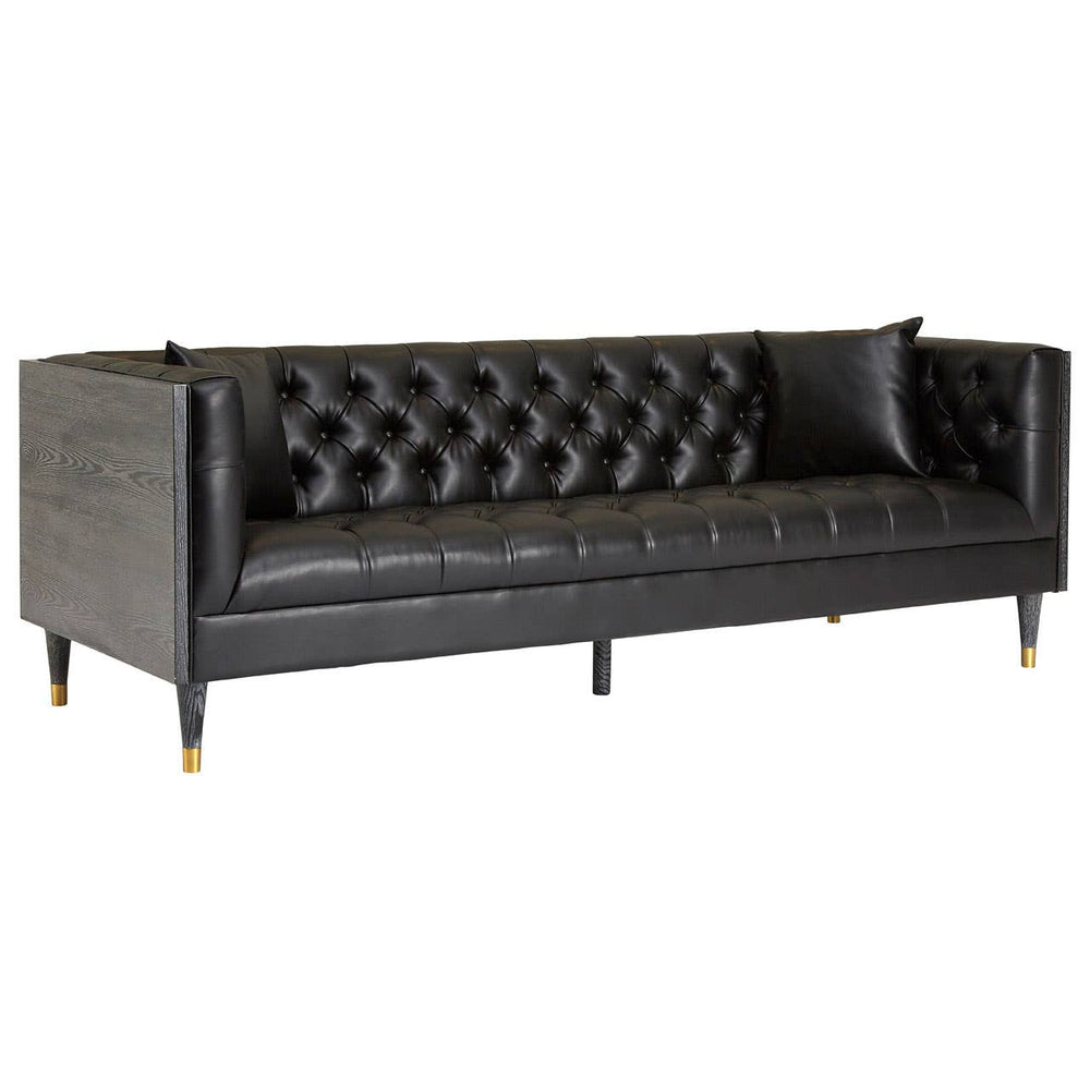 Three-seat sofa upholstered in black faux leather, featuring a tufted backrest and sleek armrests. The sofa is supported by slender legs with gold accents, adding a touch of elegance to its modern design