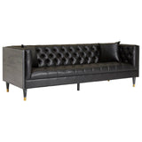 Three-seat sofa upholstered in black faux leather, featuring a tufted backrest and sleek armrests. The sofa is supported by slender legs with gold accents, adding a touch of elegance to its modern design