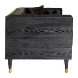 Black faux leather sofa with a sleek design, featuring a low back and rounded edges. The sofa has a smooth texture and is supported by tapered wooden legs. The overall aesthetic is modern and minimalist, suitable for contemporary home decor
