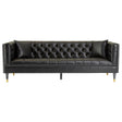 A three-seat sofa upholstered in black faux leather, featuring a tufted backrest and sleek, gold-colored legs. The design includes armrests with a modern, angular shape, creating a stylish and contemporary look suitable for various living spaces